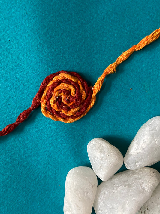 Spiral-Rakhi-Upcycled-red-close-up