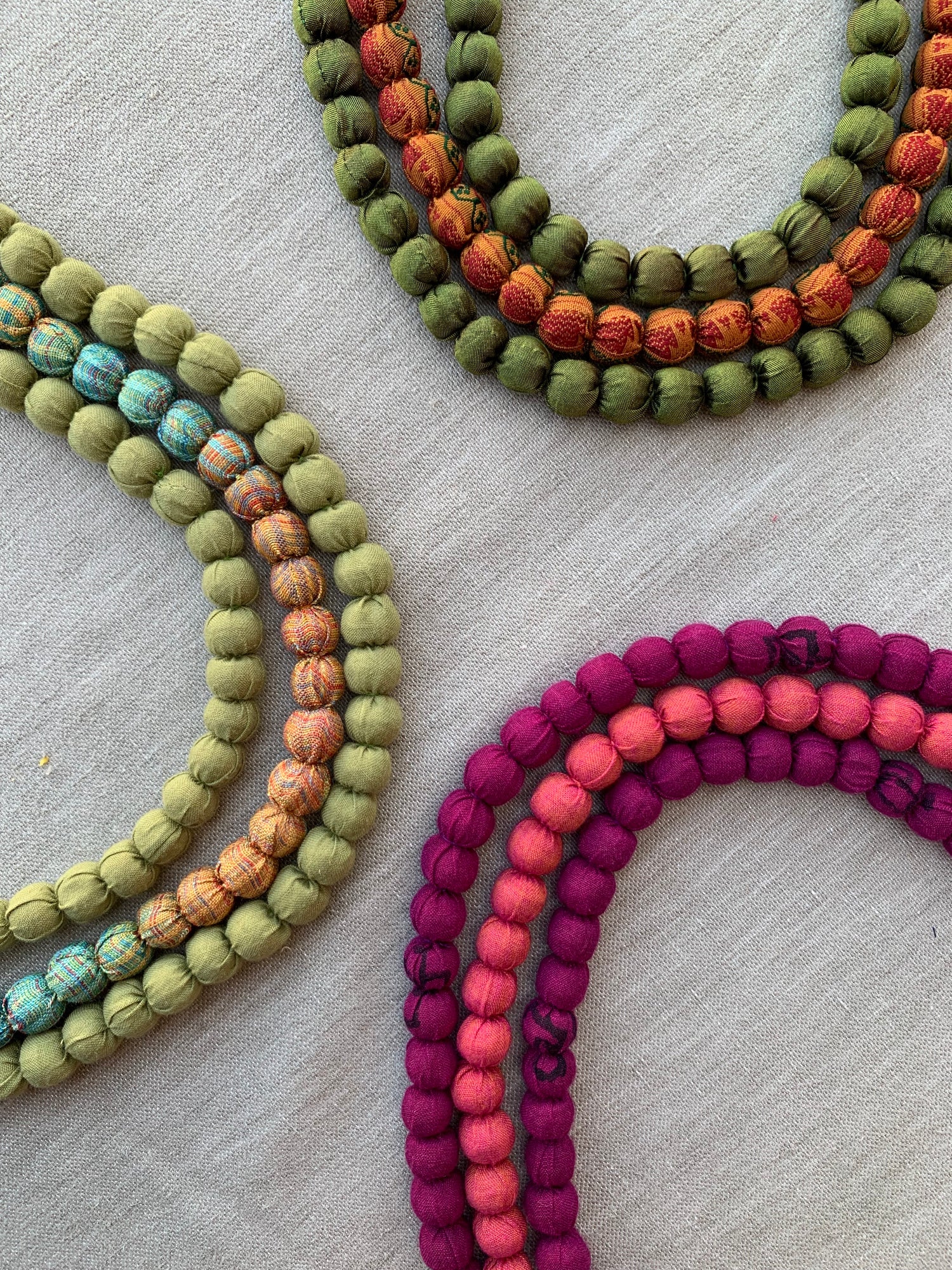 beaded necklaces all made using fabric scraps. Unlock the potential of your textile waste with Oh Scrap! Madras.